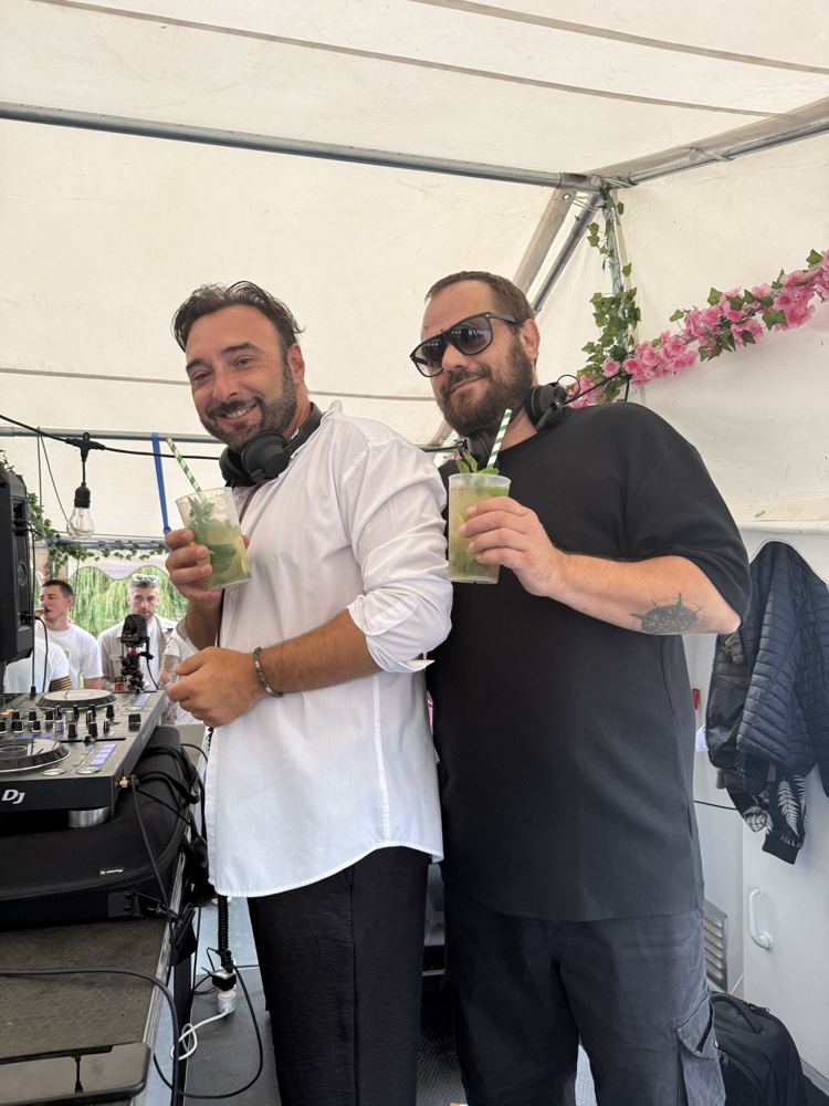 Behind the decks at an open-air party